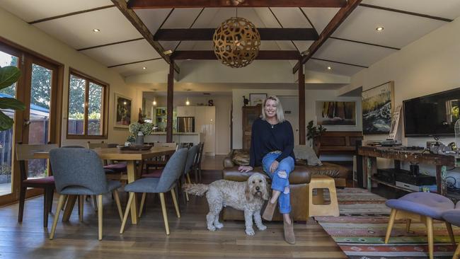 Sarah McDonald at her home with the dog, Raph. Picture: Roy VanDerVegt