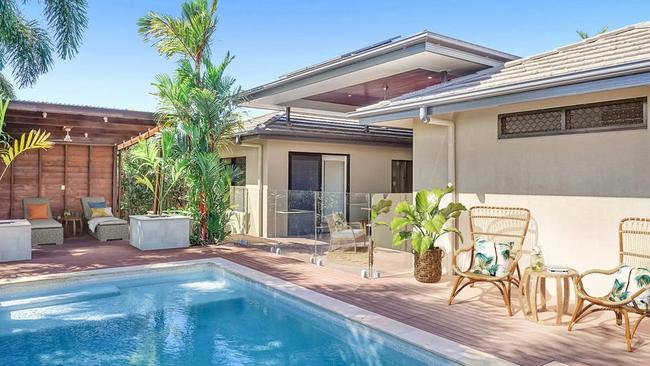 This “tropical retreat” in Kewarra Beach has four bedrooms and is listed for offers from $699,000