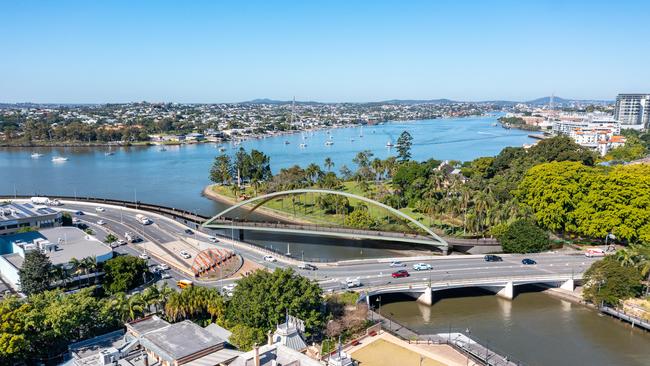 Aerial view, showing the new bridge to the rear behind the existing car, cycle and pedestrian bridge.