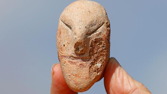 A figurine of a human face unearthed at En Esur. Picture: AFP