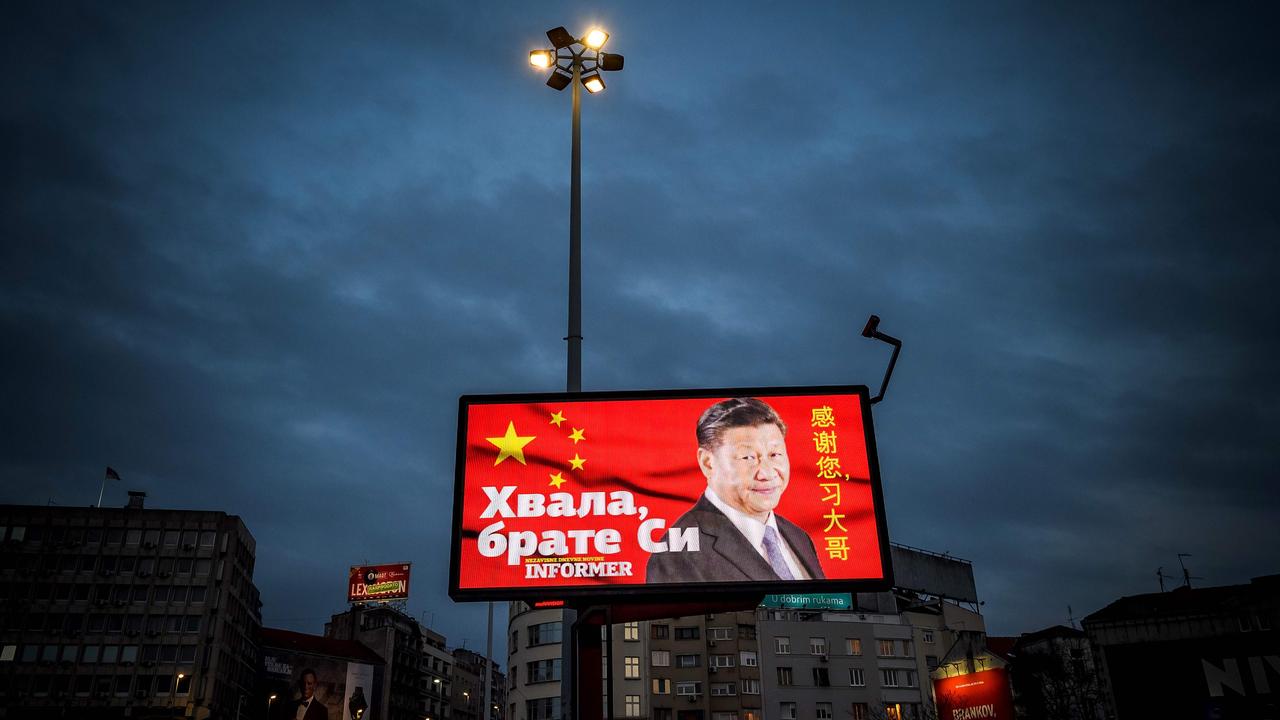 A billboard bearing Chinese President Xi Jinping's face looking down over a boulevard next to the words ‘Thank you brother Xi’, a message paid for by a pro-government tabloid. Picture: Andrej Isakovic/AFP