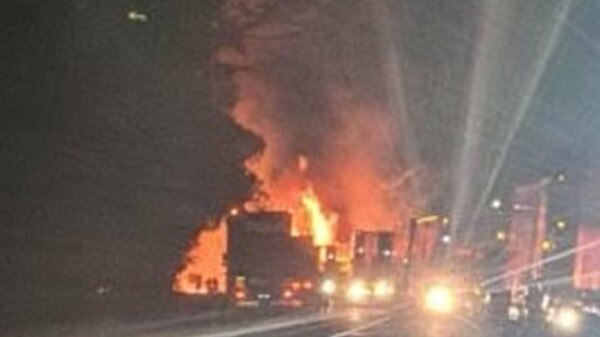 Police investigate a fiery multiple-truck crash that has caused at least one death. Picture: 3AW Radio