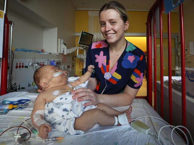 NICU nurse Alexandra Krew comforts baby George Giannakopoulos under her care. Picture: David Caird