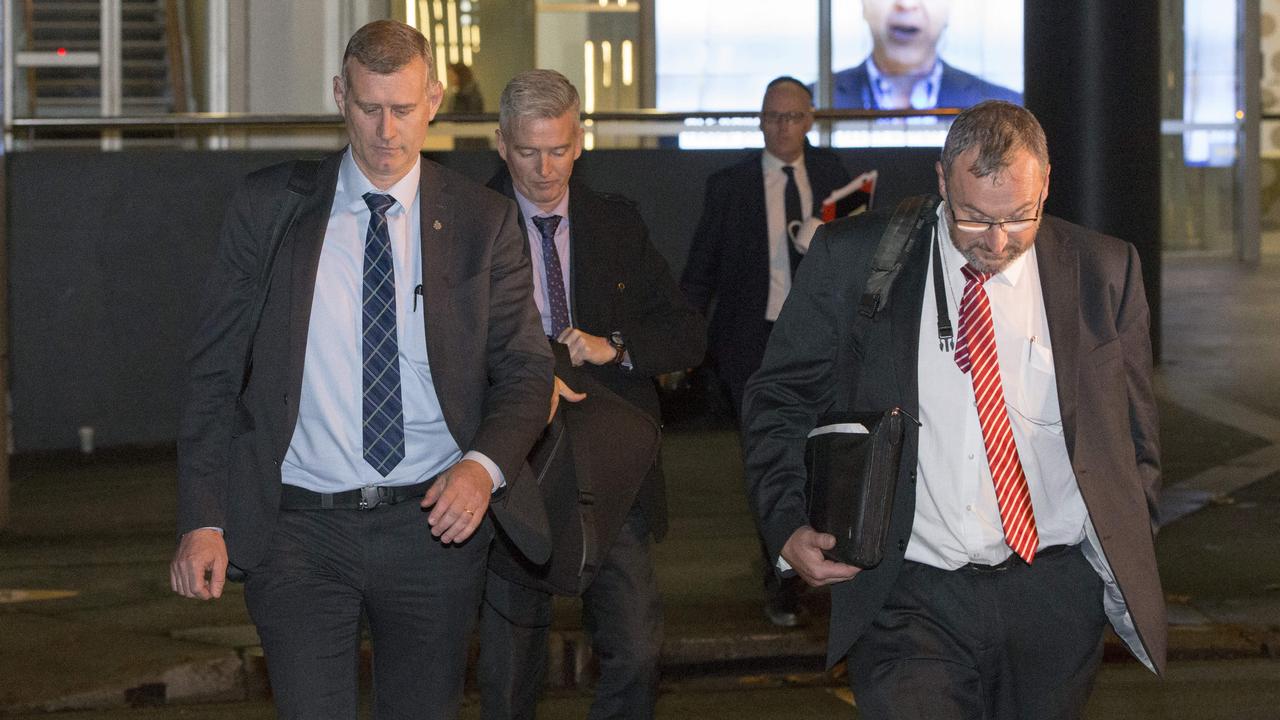 AFP officers leave the ABC in Ultimo after spending several hours inside. Picture: Damian Shaw