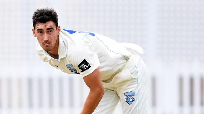 Mitchell Starc of the Blues bowls to Simon Mackin.