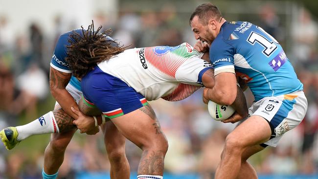 Kevin Proctor and Jaimin Jolliffe try to bring down Addin Fonua-Blake of the Warriors. Picture: Matt Roberts/Getty Images