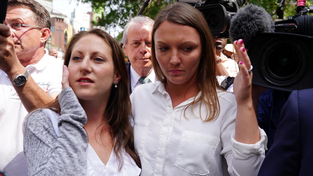 Michelle Licata and Courtney Wild, who say they are victims, leave following the arraignment of US financier Jeffrey Epstein. Picture: Carlo Allegri