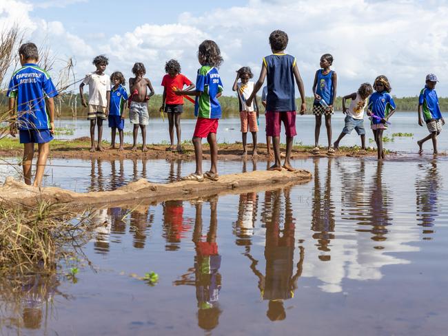 Gapuwiyak children play by Lake Evella, which sits on the edge of the community, in northeast Arnhem Land.