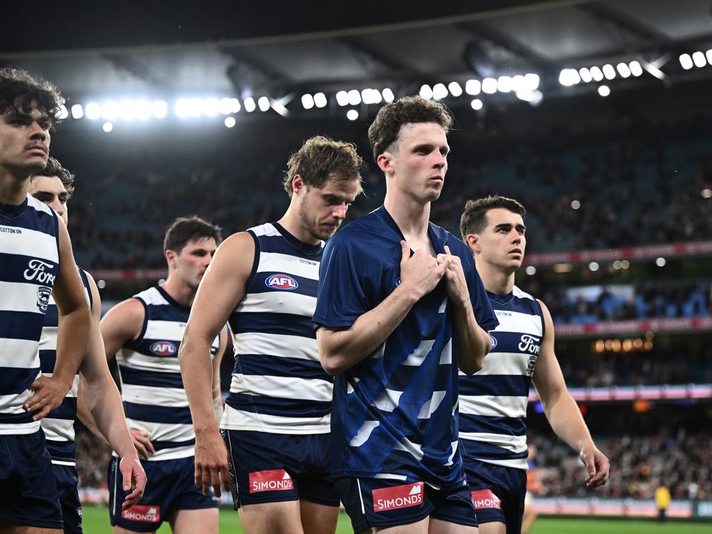 Max Holmes and the Cats walk off on Saturday. Picture: Quinn Rooney/Getty Images.