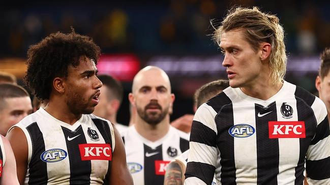 MELBOURNE, AUSTRALIA - JULY 20: The Magpies look dejected following the round 19 AFL match between Hawthorn Hawks and Collingwood Magpies at Melbourne Cricket Ground on July 20, 2024 in Melbourne, Australia. (Photo by Graham Denholm/AFL Photos/via Getty Images)