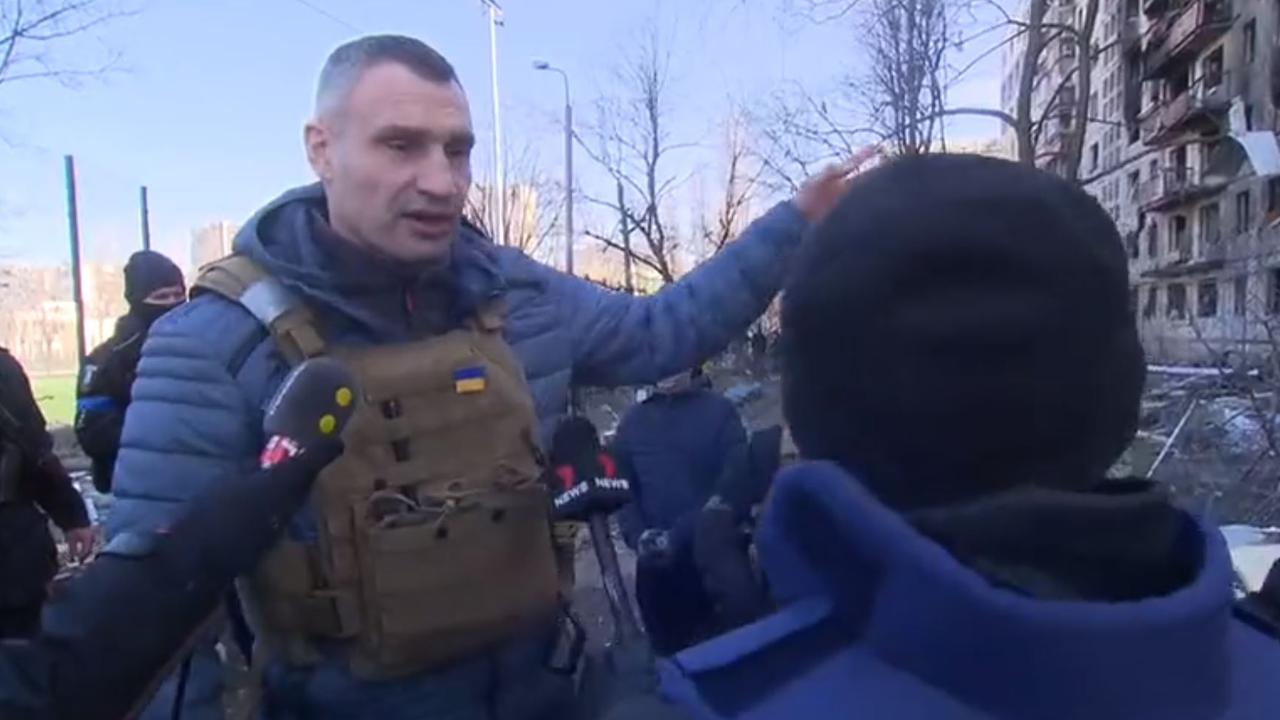 Klitschko gestures towards a bombed building. Picture: Chris Reason/Twitter