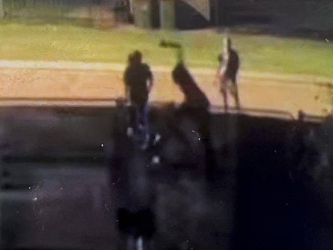CCTV Footage shows a youth scaling a Gray residence fenceline, trying to attack the resident on the other side.