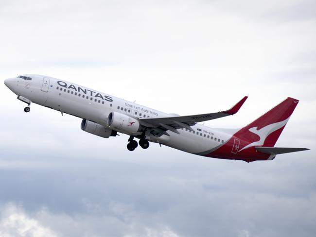 ADELAIDE, AUSTRALIA - NewsWire Photos August 10, 2022: Qantas aircraft at Adelaide Airport.Qantas will increase the waiting time between domestic to international connecting flights by 30 minutes in an effort to mitigate the number of people arriving at their destination without their luggage and has asked executives to work as baggage handlers for three months. Picture: NCA NewsWire