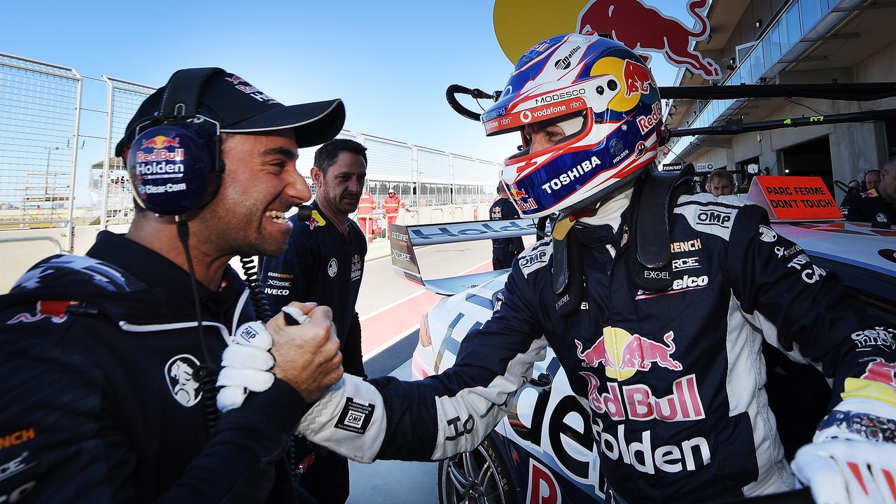 Jamie Whincup and race engineer David Cauchi (L) celebrate pole position for Race 22.
