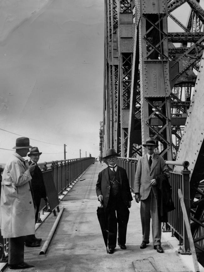 The Story Bridge is inspected by engineer Dr J.J.C. Bradfield (left) and L.R. Wilson, chief engineer for steel construction