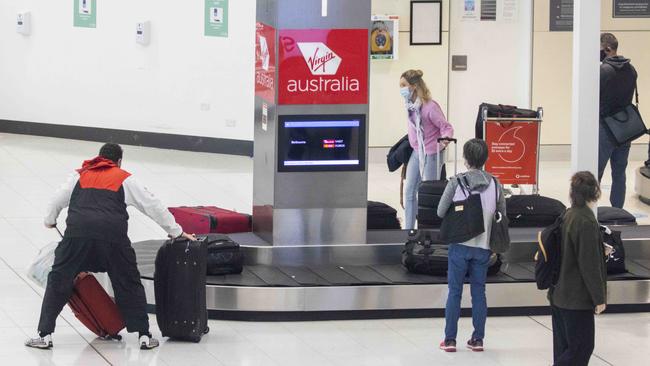 Passengers are seen at the baggage claim area at Sydney Domestic airport. Picture: NCA NewsWire / Jenny Evans