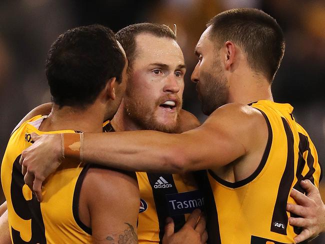 AFL Round 5.  Hawthorn vs. West Coast Eagles at the MCG .  Hawks players swamp Jarryd Roughead after he kicked his 500th career goal in the last qtr   . Pic: Michael Klein