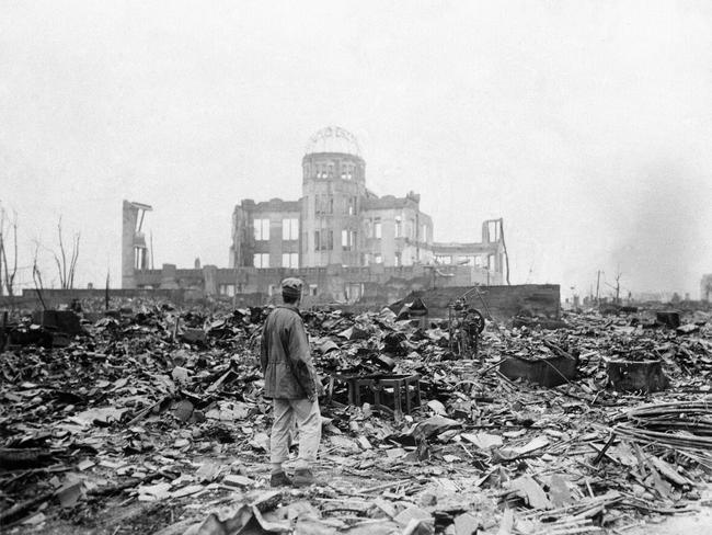 A man stands among the rubble in Horishima a month after it was struck by an atomic bomb in 1945.