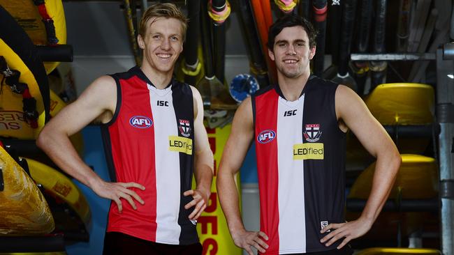 St Kilda draftees Hugh Goddard and Paddy McCartin show off their new jumpers at the Kurrawa Beach Surf Life Saving Club on the Gold Coast