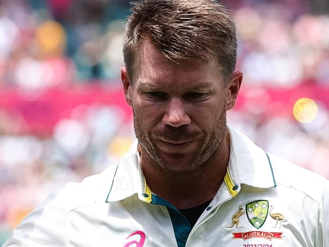 SYDNEY, AUSTRALIA - JANUARY 06: David Warner of Australia raises his bat to the crowd after getting out in his last test match during Day 4 of the third test match between Australia and Pakistan at the Sydney Cricket Ground on January 06, 2024 in Sydney, Australia. (Photo by Pete Dovgan/Speed Media/Icon Sportswire via Getty Images)