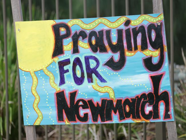 Sign, flowers and tributes are being left outside Newmarch House. Picture: Christian Gilles