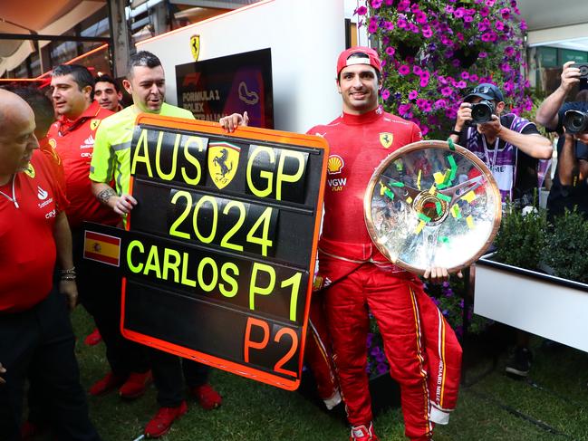 MELBOURNE, AUSTRALIA - MARCH 24: Race winner Carlos Sainz of Spain and Ferrari celebrates with his team following the F1 Grand Prix of Australia at Albert Park Circuit on March 24, 2024 in Melbourne, Australia. (Photo by Peter Fox/Getty Images)