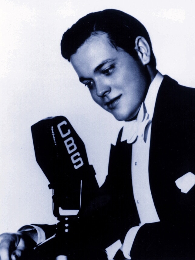 Young Orson Welles was seated next to the soon-to-be-German leader at a rally.