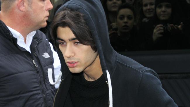 Shock look ... Zayn Malik looked spaced out as he arrived to record the Band Aid single last week. Picture: Getty Images