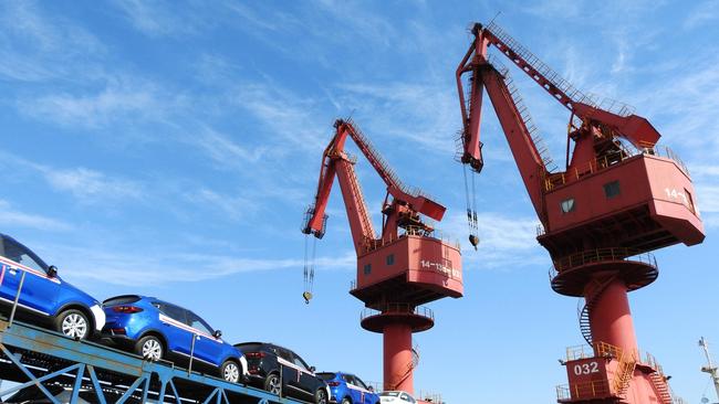 (FILES) This file picture taken on May 31, 2018 shows cars to be exported at a port in Lianyungang in China's eastern Jiangsu province. Simmering trade tensions between the world's top two economies are set to erupt into a full-blown trade war on July 6, 2018, with Washington poised to impose new tariffs on 34 billion USD in Chinese goods.  / AFP PHOTO / - / China OUT / TO GO WITH AFP STORY CHINA-US-TRADE by Ryan MCMORROW