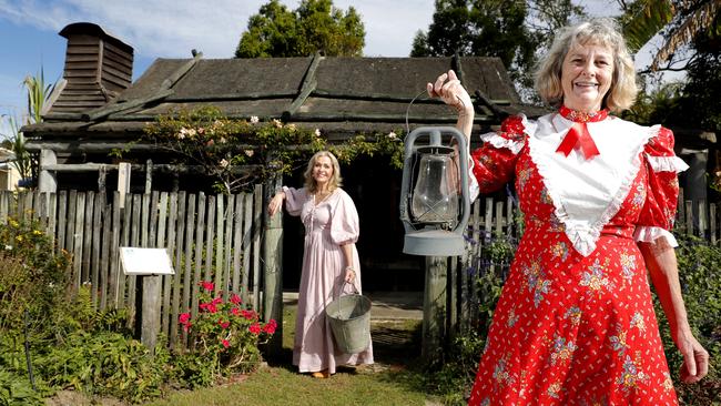 Volunteers Lynette Wilson (left) and Pam Hill pose in front of the Veivers early settlers cottage on display at the Gold Coast Historical Museum during the open day, Sunday, July 9, 2023. Photo: Regi Varghese