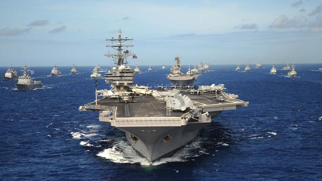 US Navy Nimitz-class nuclear aircraft carrier USS Ronald Reagan leads a group of multinational ships during RIMPAC (Rim of the Pacific) exercises in the Pacific Ocean.