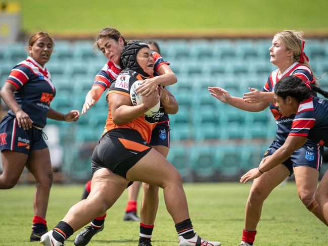 Alavina Tu'ifua is hit with a high shot. Picture: Julian Andrews