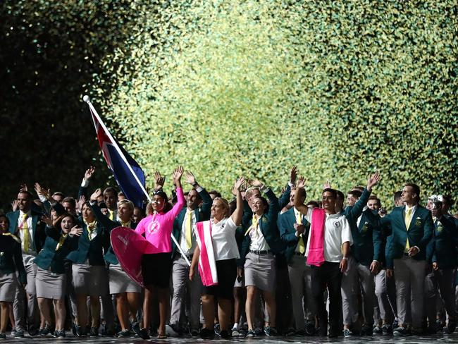 GOLD COAST, AUSTRALIA - APRIL 04:  Mark Knowles, flag bearer of Australia arrives with the Australia team during the Opening Ceremony for the Gold Coast 2018 Commonwealth Games at Carrara Stadium on April 4, 2018 on the Gold Coast, Australia.  (Photo by Ryan Pierse/Getty Images)