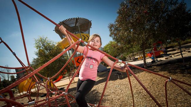 Ella, 6, checks out the climbing ropes at Mandrel Drive.