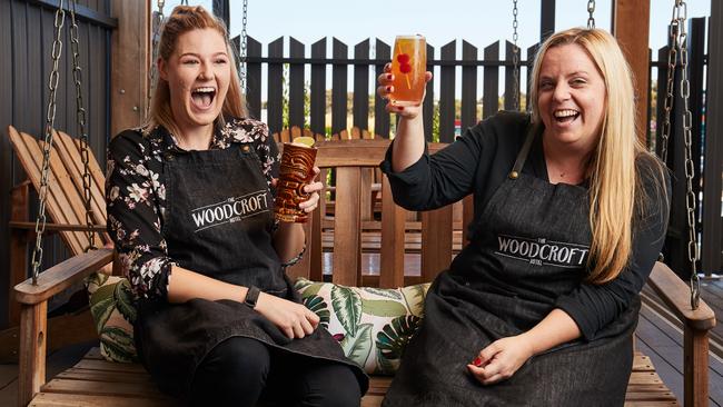 Brittany Robertson and Lindsie Briscoe with cocktails on the deck at The Woodcroft Hotel. Picture: AAP/Matt Loxton