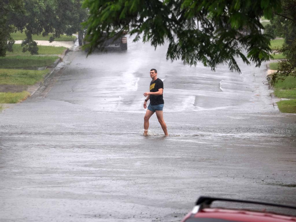 People should wear protective clothing while walking through flooded areas and cleaning up after the cyclone. Picture: NewsWire/Tertius Pickard