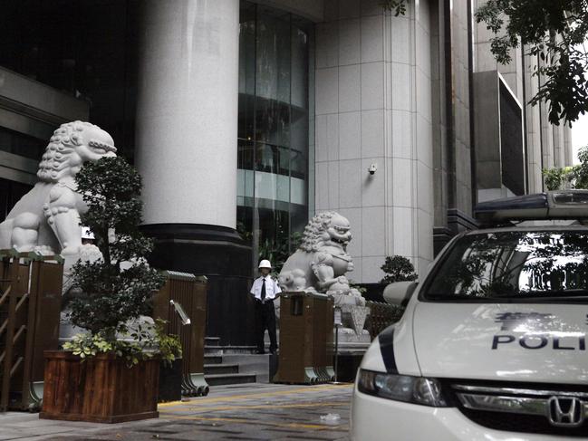 A security guard stands on duty outside the Guangzhou Intermediate People’s Court. Picture: AP