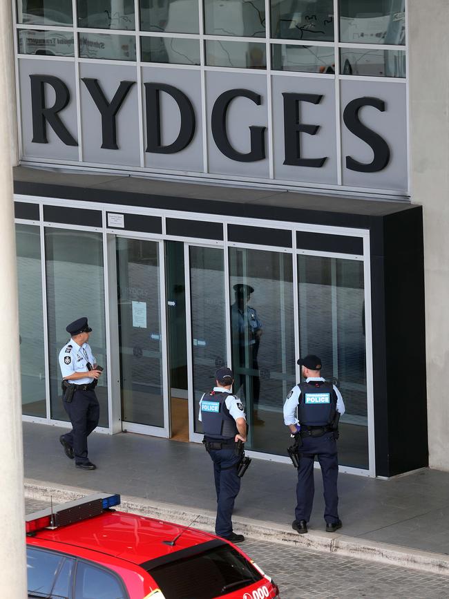 Police guard quarantined travellers at Sydney's Rydges Hotel.