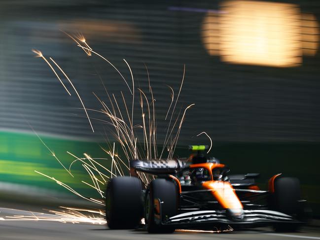 Sparks fly behind Lando Norris of Great Britain driving the (4) McLaren MCL38 Mercedes on track during practice ahead of the F1 Grand Prix of Singapore. Picture: Getty Images