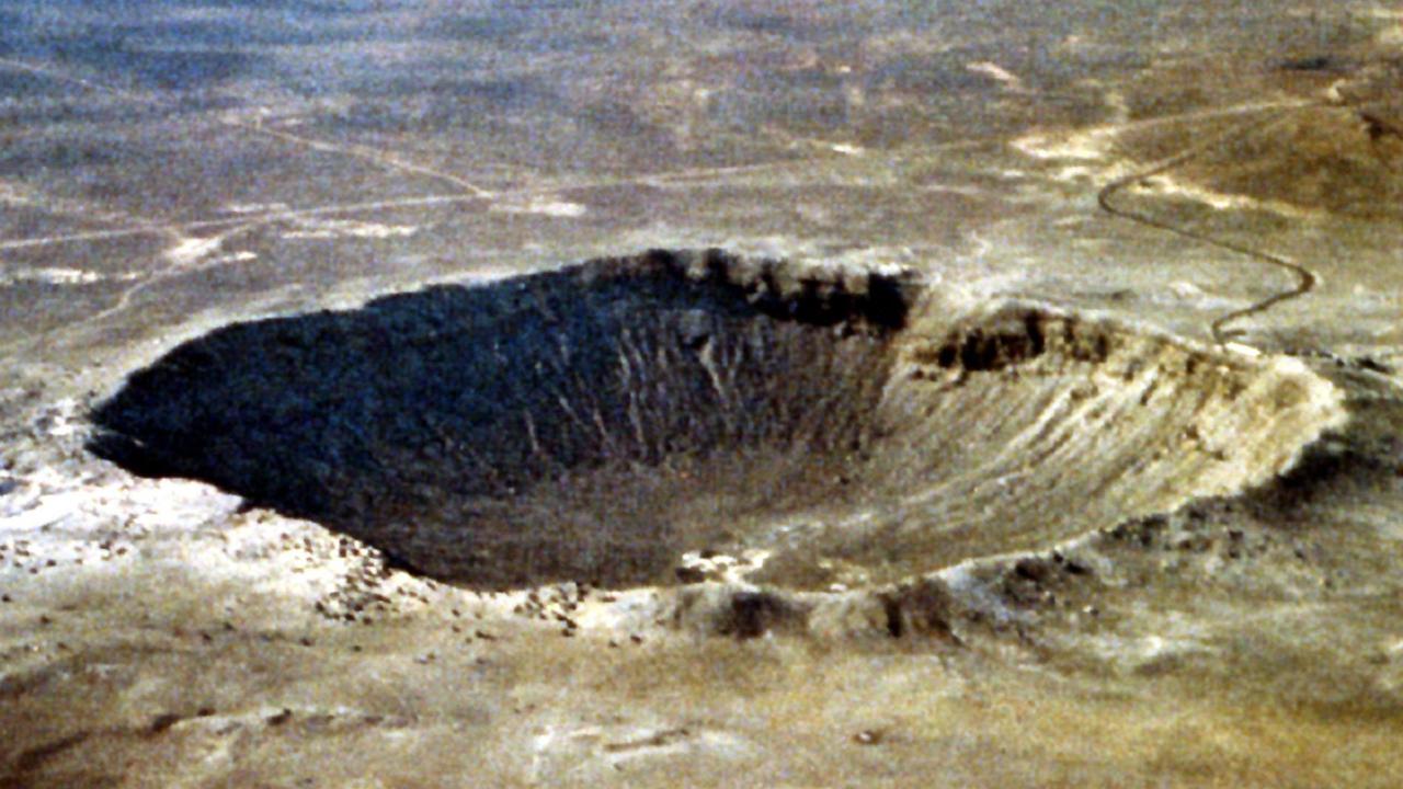 This NASA file image shows a meteor crater in Arizona, USA. Other asteroids and meteors have struck Earth in its long history – but the new 2024 YR4 asteroid is not expected to be one of them. Picture: Getty OUT/AFP Photo/HO/NASA