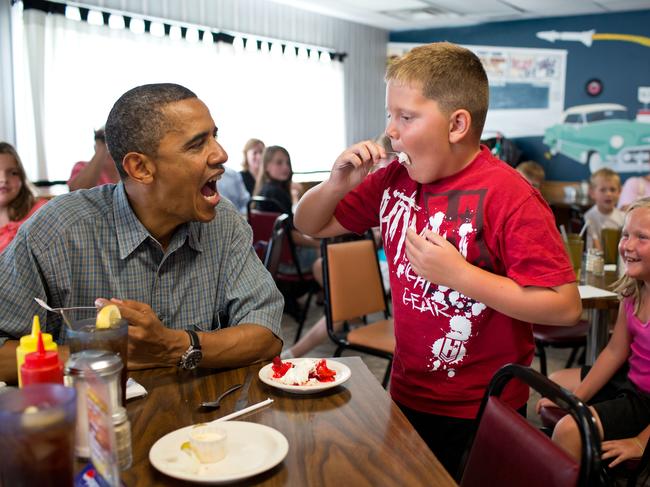 President Barack Obama shares his strawberry pie with a boy during a lunch stop at Kozy Corners restaurant in Oak Harbor, Ohio on July 5, 2012. Picture: Pete Souza/The White House