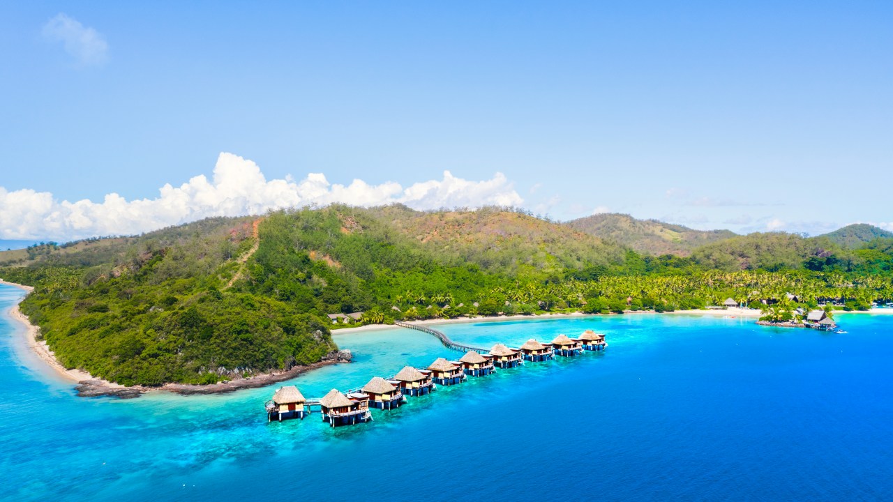 <h2>Location</h2><p><span><a href="https://likulikulagoon.com/" target="_blank" rel="noopener">Likuliku Lagoon Resort</a> is on Malolo Island in Fiji&rsquo;s Mamanuca group, nestled into its north-west corner. It feels delightfully remote yet easy to reach &ndash; I leave Brisbane at lunchtime and am eating fresh Fijian walu (Spanish mackerel) that night. After a three-and-a-half hour flight from Brisbane to Nadi, a 20-minute road transfer puts me at Port Denarau Marina where my speedboat transfer awaits. Depending on arrival times, the ferry is also an option, as are helicopter transfers.</span></p>