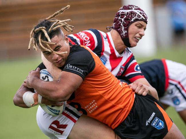 10/02/2024. News Local. Sport. Leichardt, Sydney, NSW, Australia.NSWRL Junior Reps, SG Ball Cup round two, Balmain Tigers vs Sydney Roosters at Leichhardt Oval, 10 February 2024Roosters won the game 13-12 with an incredible last second field goal.Pic shows:Tigers player: Xavier Tauaifaiga causing havocRoosters player:  Picture: Julian Andrews