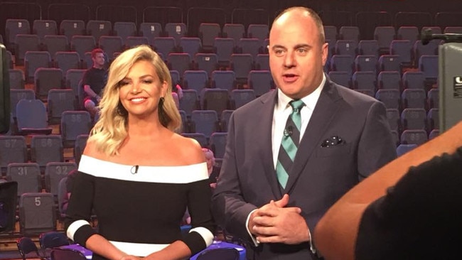 Rebecca Maddern and Craig Hutchison hosting The Footy Show.