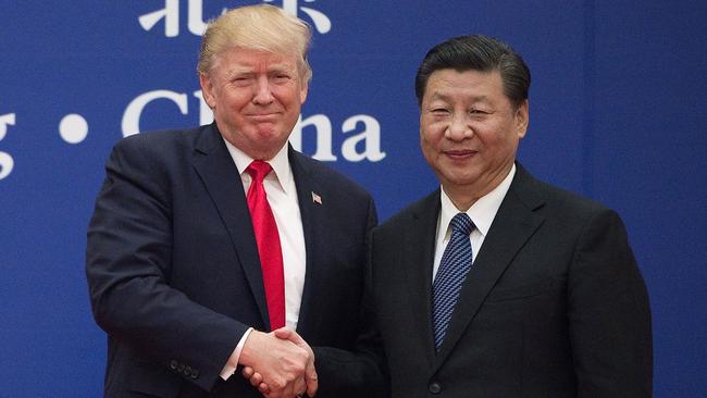 Then president Donald Trump and China's President Xi Jinping shake hands during a business leaders event at the Great Hall of the People in Beijing in 2017. Picture: AFP