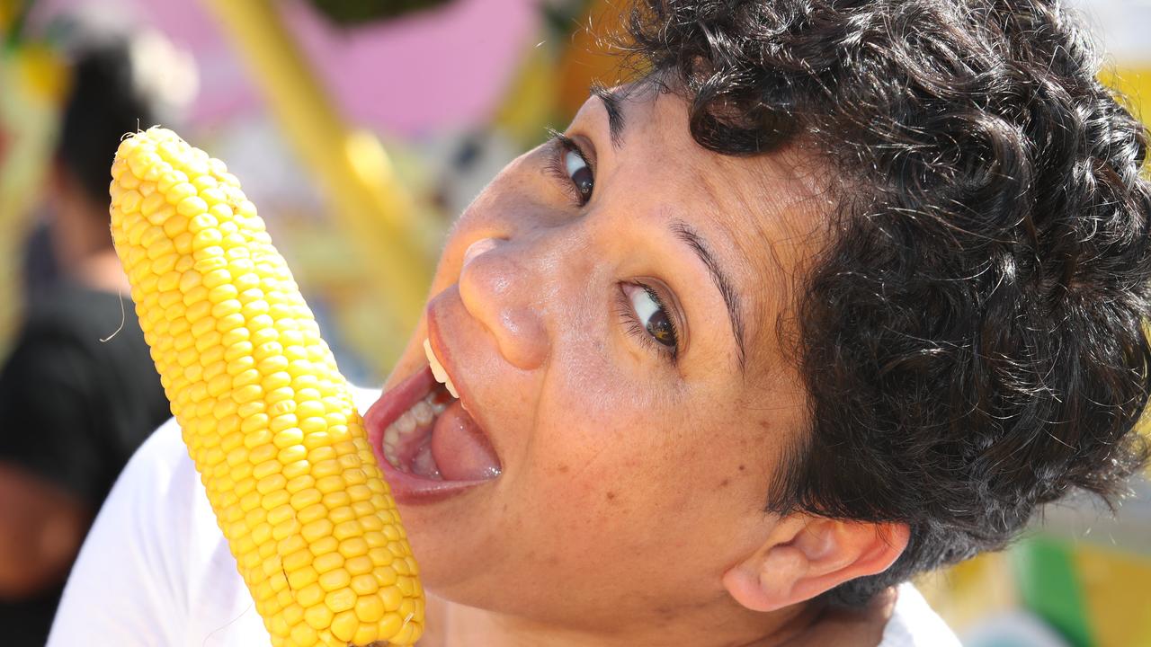 Huge crowds for the first day of the Gold Coast Show. Mariata Takuira enjoys some corn. Picture: Glenn Hampson