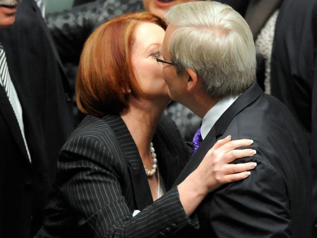 Prime Minister Julia Gillard hugs and kisses foreign minister Kevin Rudd after the carbon tax legislation was passed in 2011. Picture: AAP