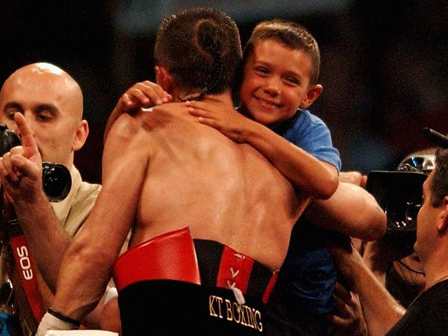 Kostya and and a young Tim after his dad’s win over Jesse James Leija in Melbourne, 2003. Picture: Nick Laham/Getty Images