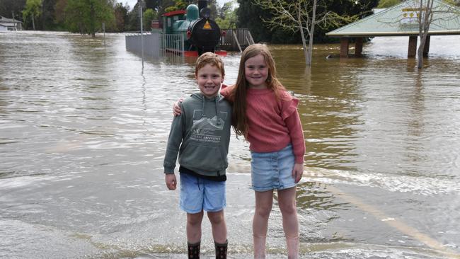 Pic captions: Blake and Madi How (kids wearing gumboots) at a flooded Deloraine Train Park. October 14, 2022.