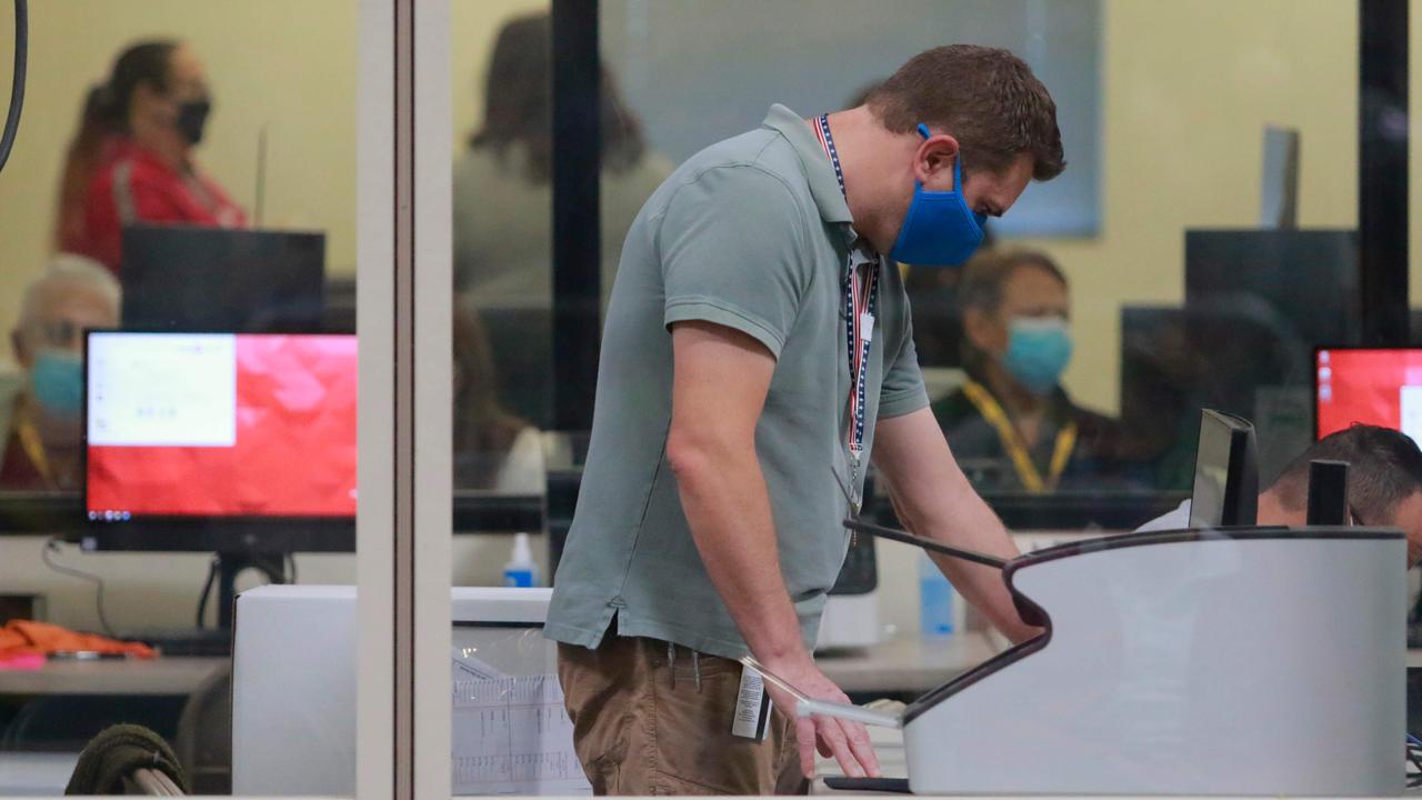 A worker handles official ballots at the Clark County Election Department in North Las Vegas on November 5. Picture: Ronda Churchill/AFP